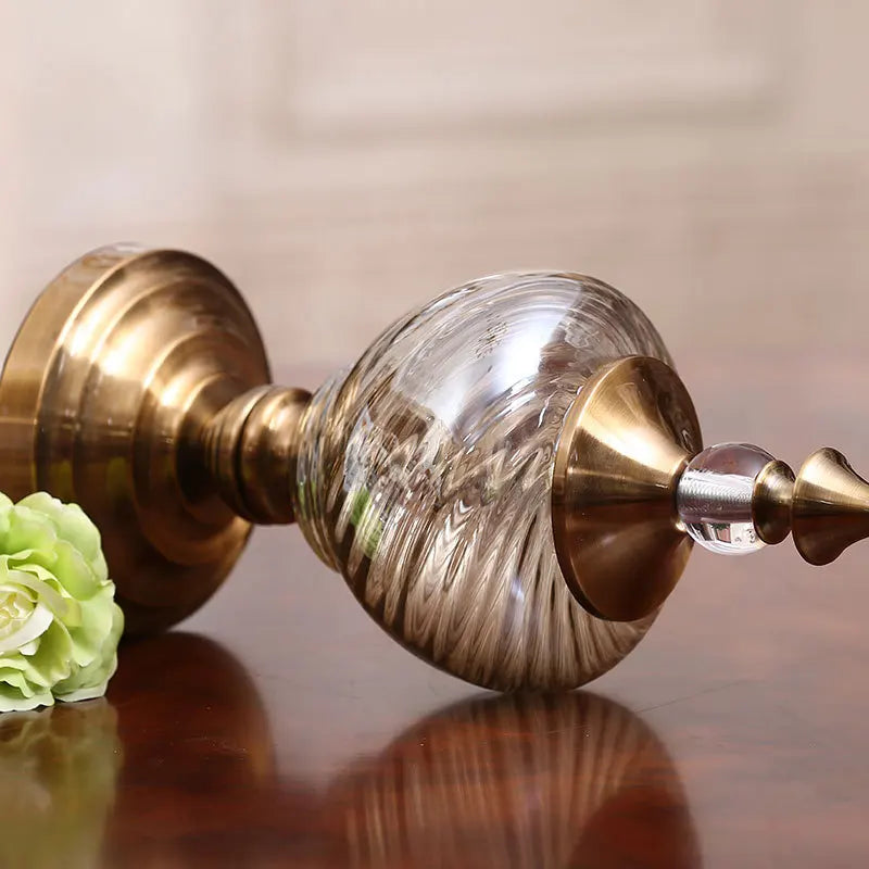 Close-up of textured glass and gold-tone detailing
